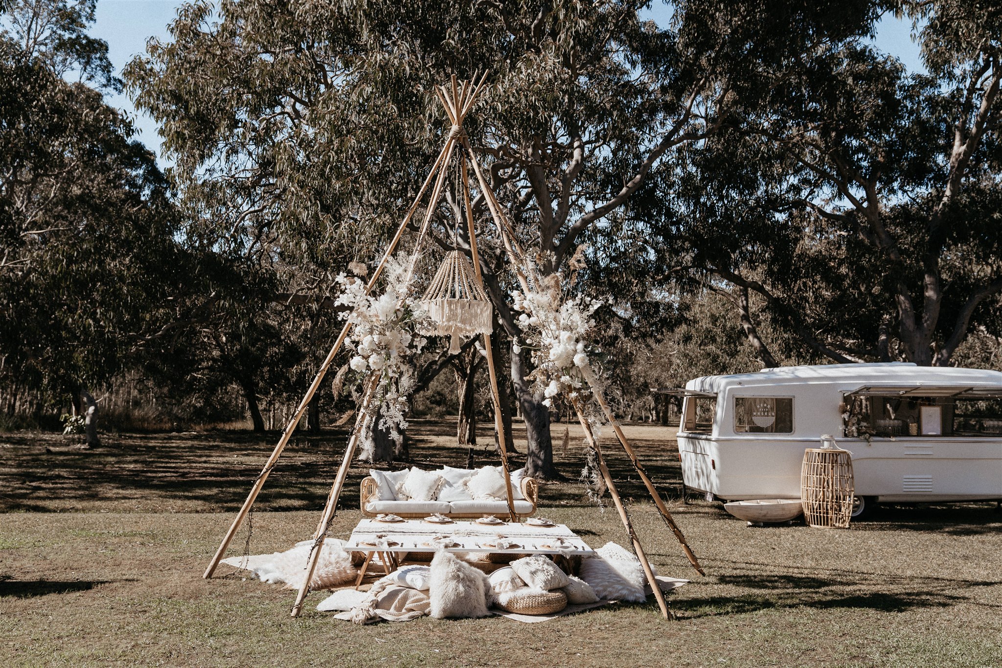 Naked Tipi with picnic table setting with Boho vibes