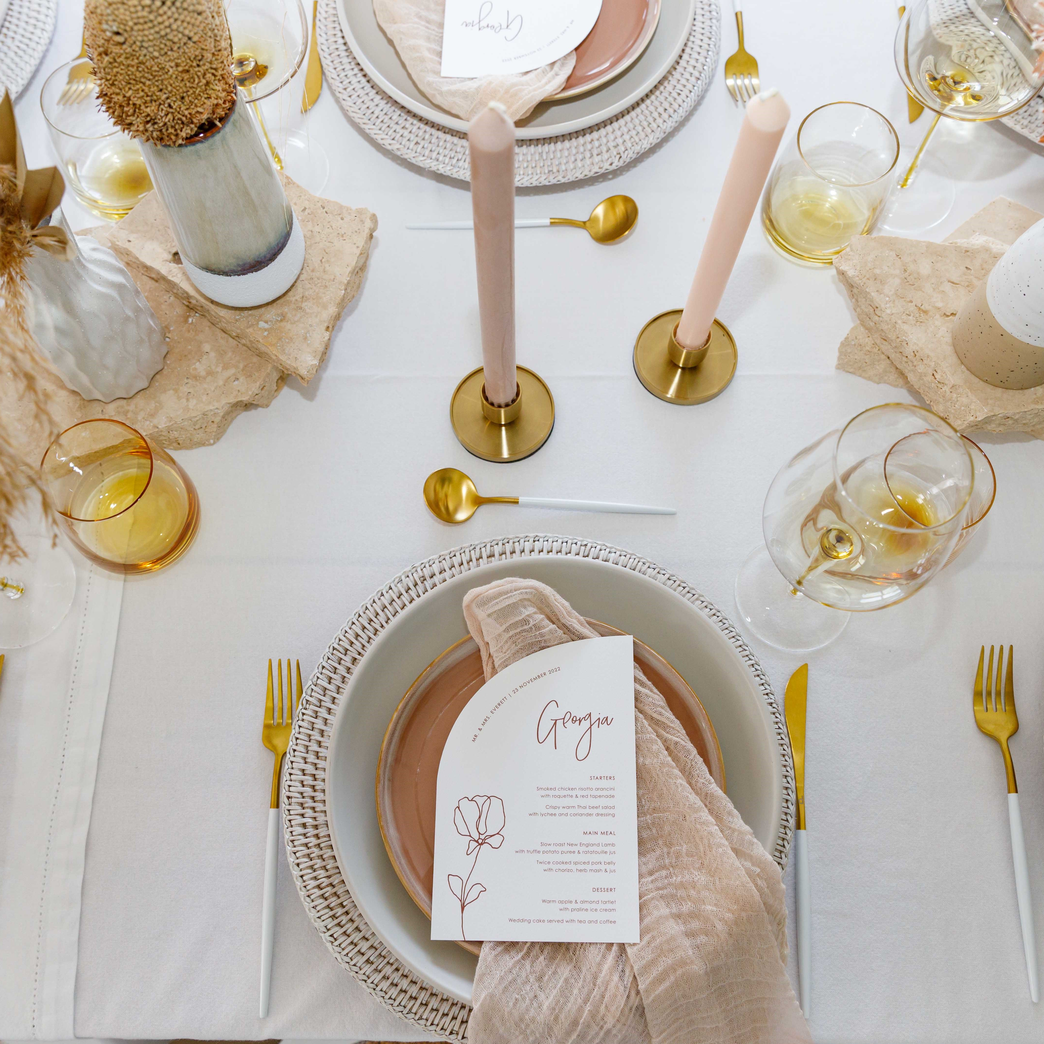 White wash charger, white and gold cutler and peach napkin