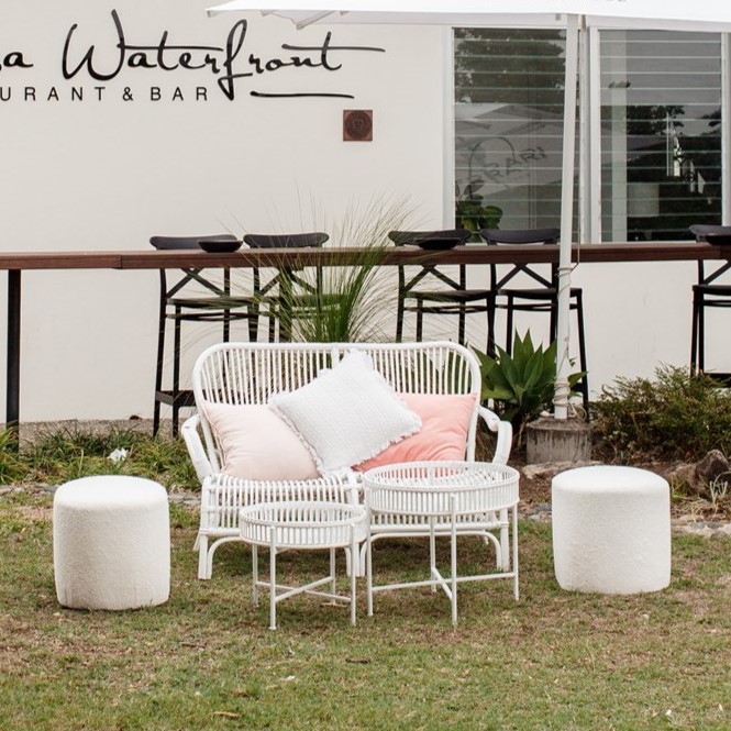White cane two seater, ottomans and island wash coffee tables
