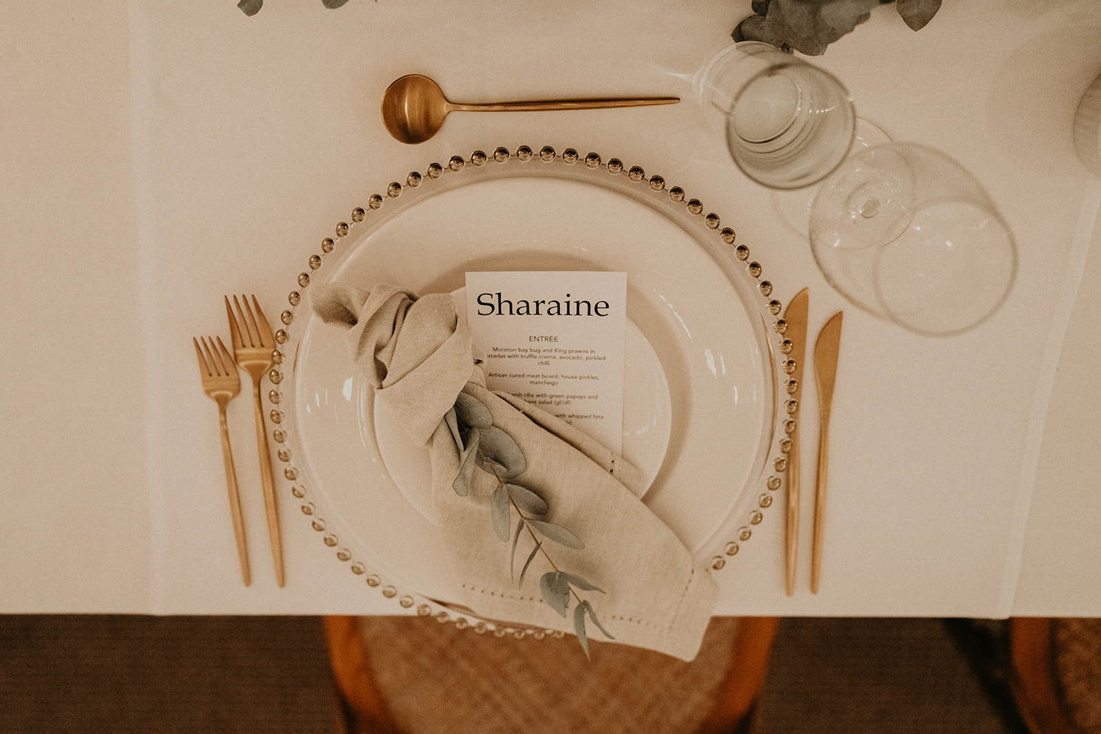 Oatmeal napkins and gold beaded charges