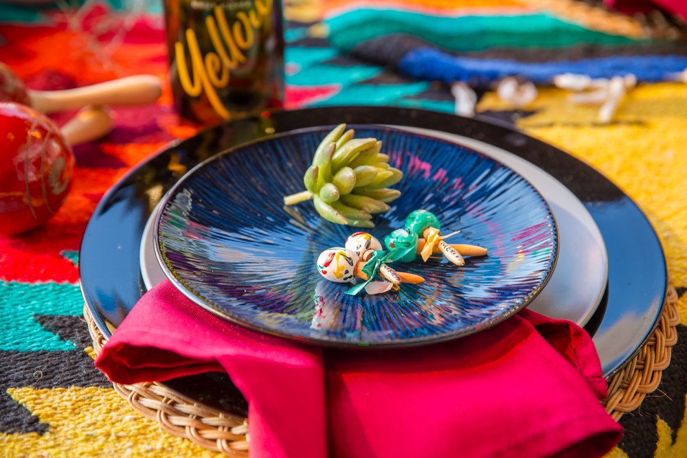 Mexican party table setting with red napkin