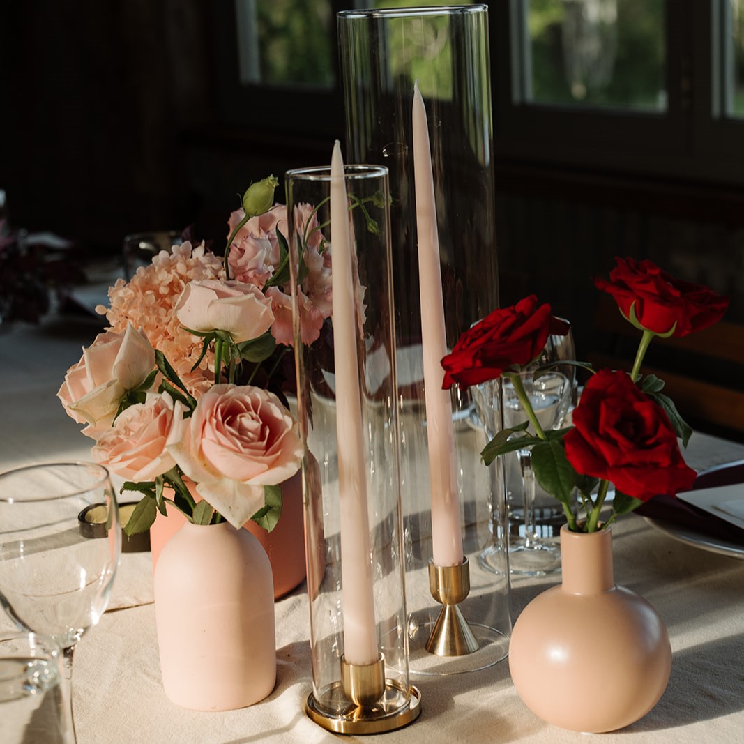 Brass candleholder with glass sleeve and taper candle