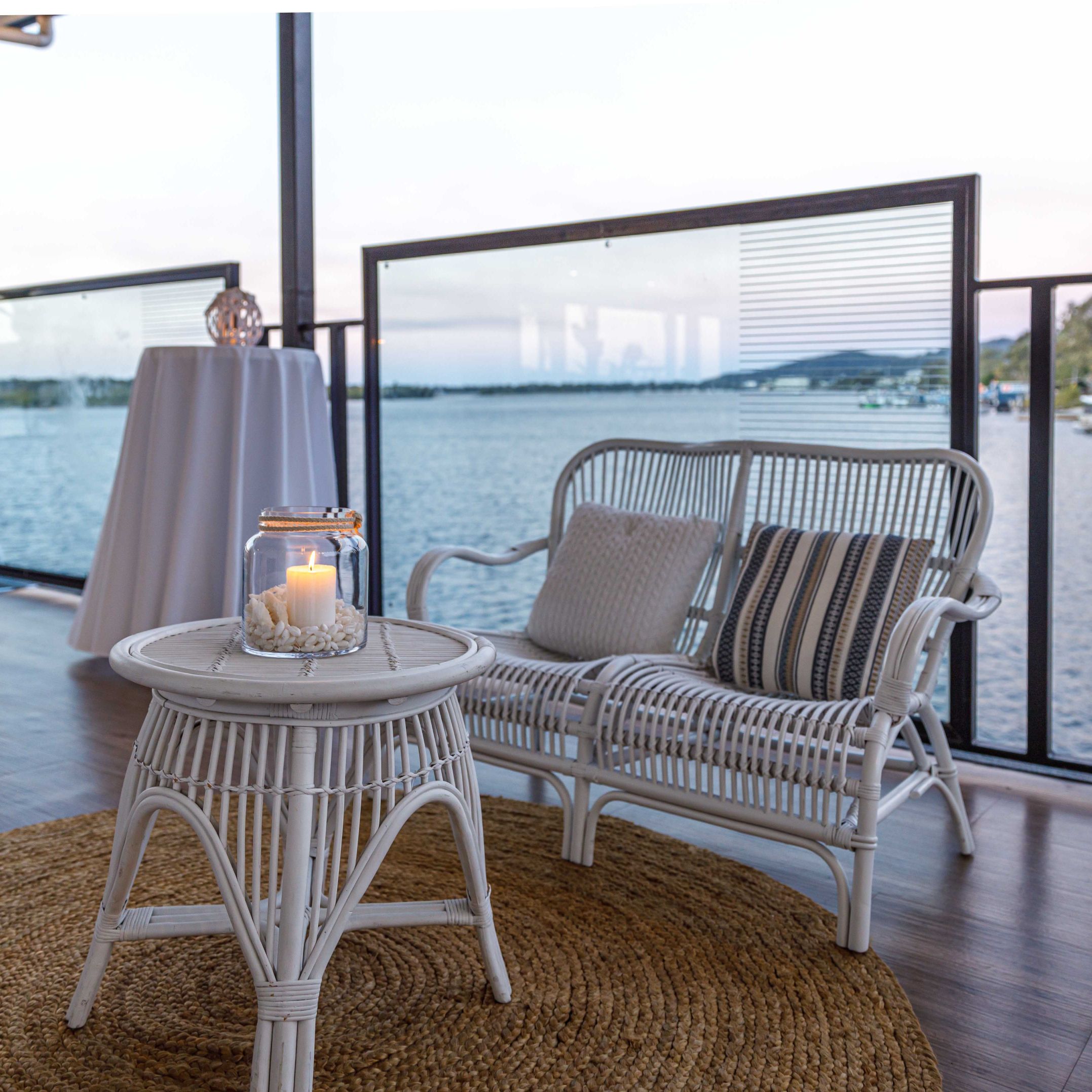 White cane two seater with coastal coffee table